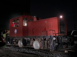 NRM President Ken Jones is at the throttle of our Plymouth diesel    in this night shot outside the shop.